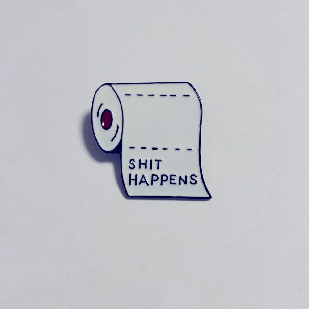 COPY - A roll of toilet paper pin with “ SHIT HAPPENS” on it - Picture 1 of 3